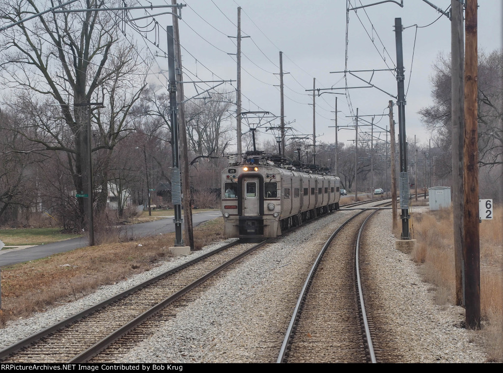 CSS 25 leads a westbound commuter train